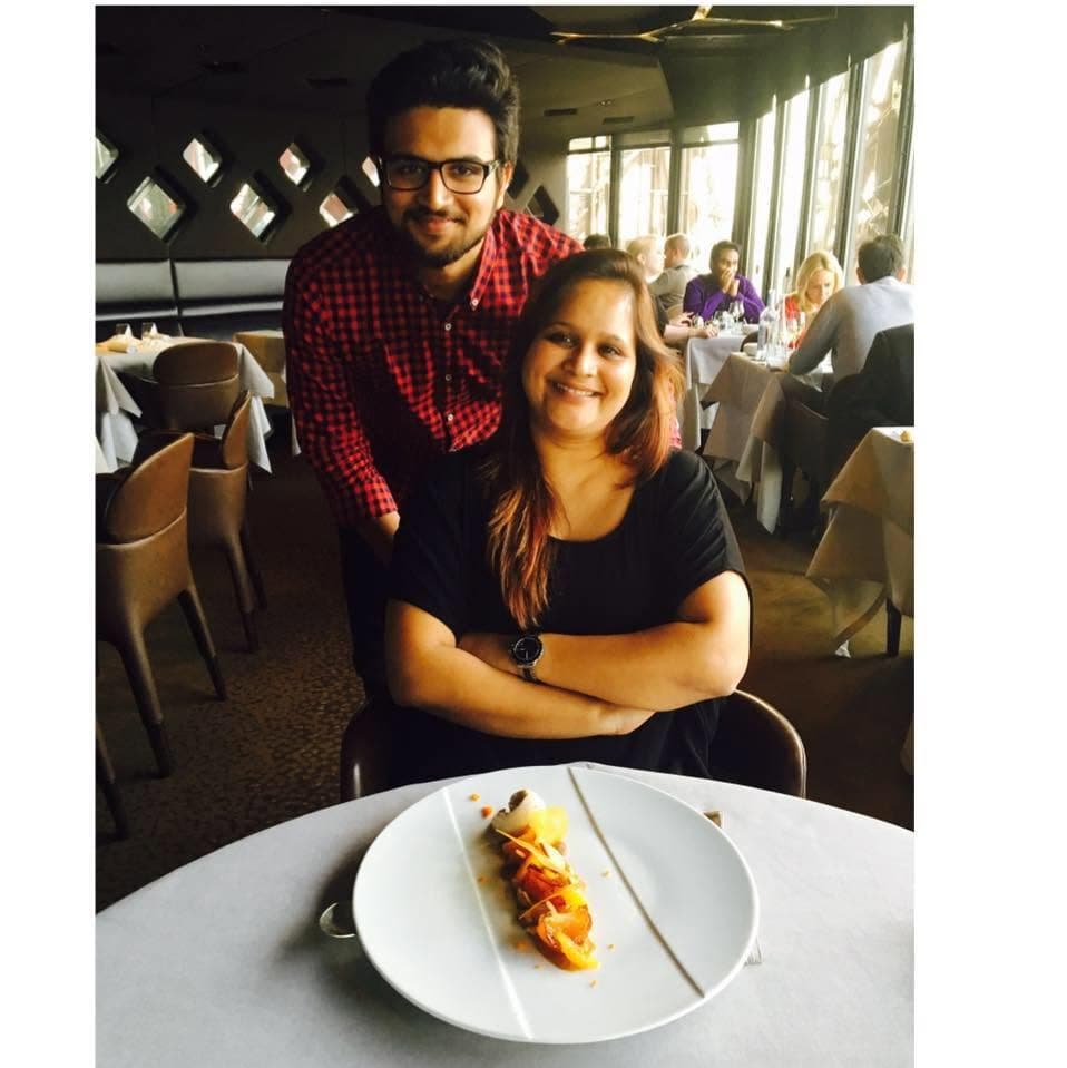 The mother and son behind Real Deal Housing, smiling together at a restaurant