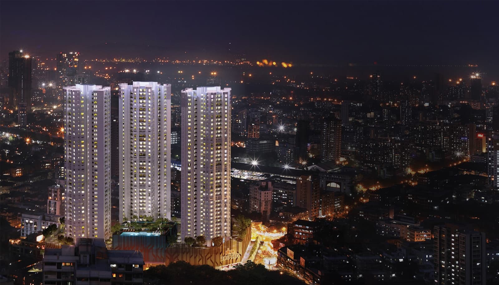 Ekta Tripolis three towers at night over the Goregaon West skyline